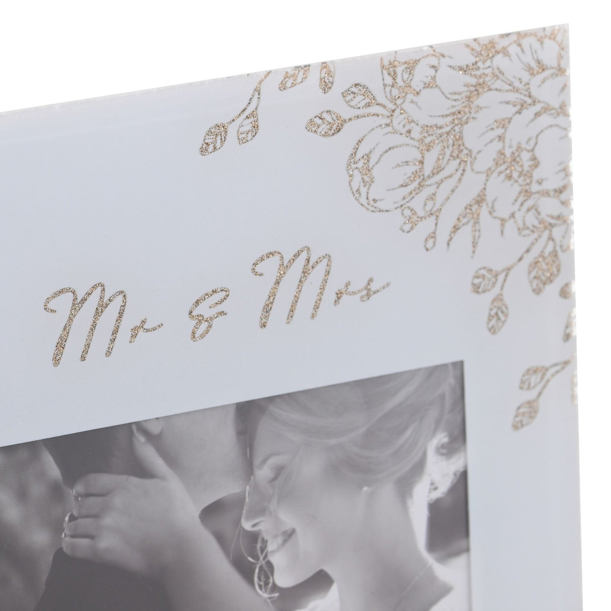 Close-up of the Mr & Mrs square glass photo frame in grey, showing gold glitter script and floral corner detailing above a 6 x 4in wedding photo.