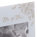 Close-up of the Mr & Mrs square glass photo frame in grey, showing gold glitter script and floral corner detailing above a 6 x 4in wedding photo.