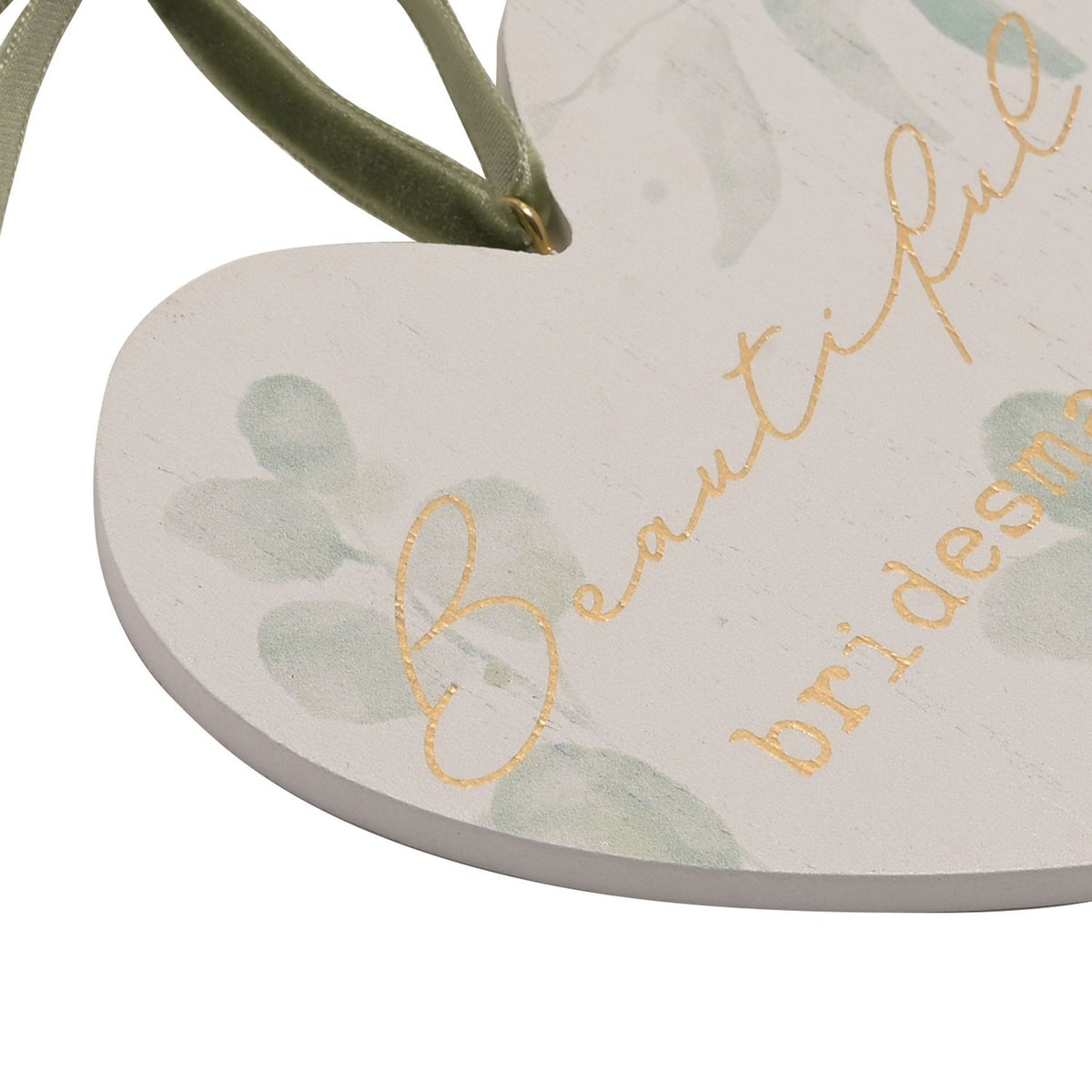 Close-up of a white hanging heart plaque with pale green leaf print and gold "Beautiful bridesmaid" lettering, hung by a green ribbon bow.