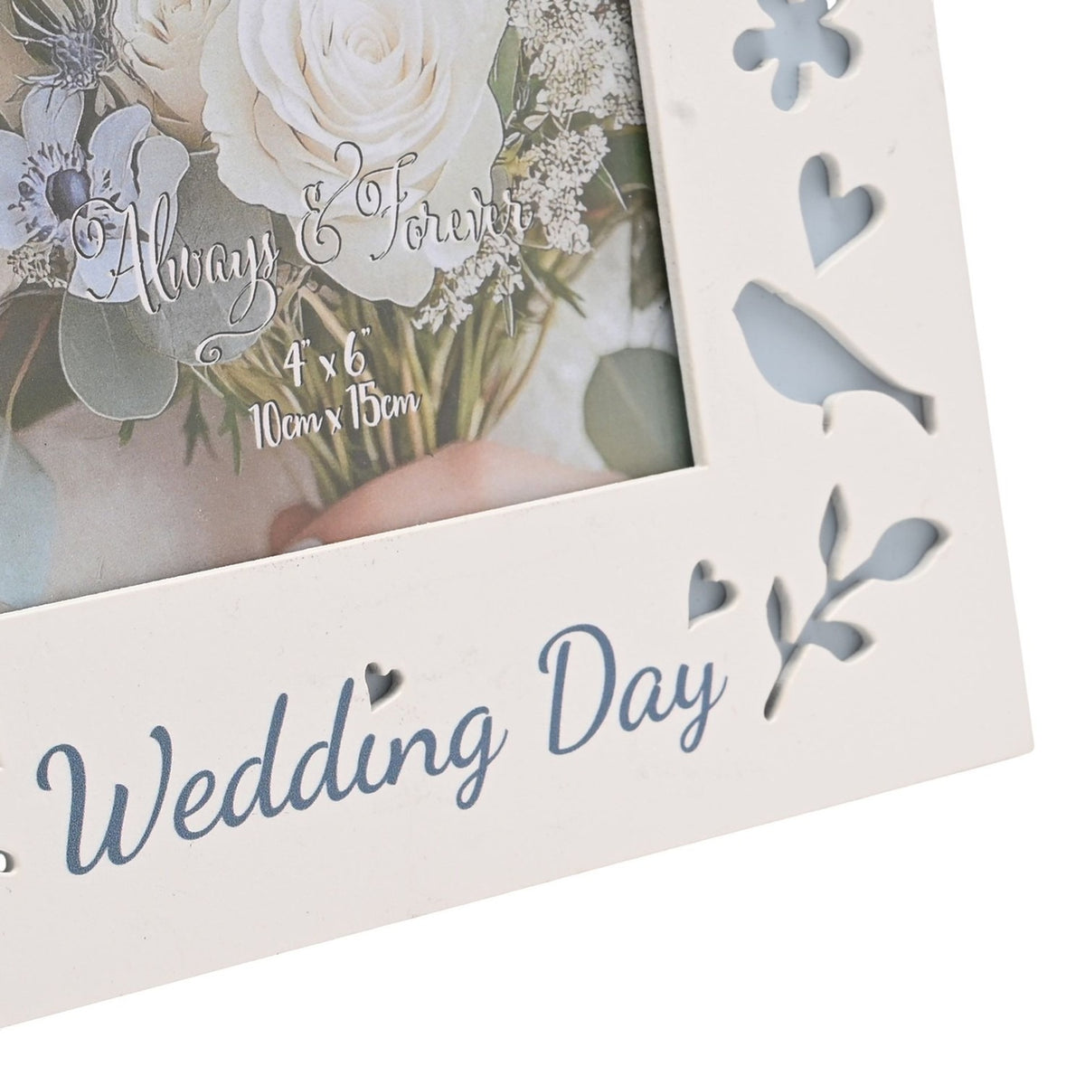 Close-up of the Wedding Day Laser Cut Photo Frame in white wood, showing "Wedding Day" script and cut-out bird, heart, flower and leaf motifs backed in pale blue.