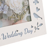 Close-up of the Wedding Day Laser Cut Photo Frame in white wood, showing "Wedding Day" script and cut-out bird, heart, flower and leaf motifs backed in pale blue.