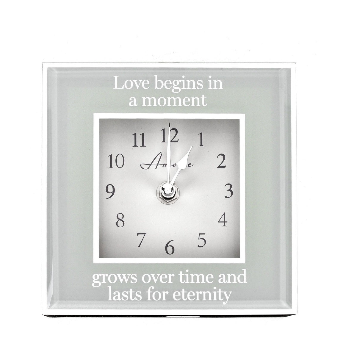 Square mantel clock, 15cm, with mirrored grey border and white dial, reading "Love begins in a moment, grows over time and lasts for eternity," on a plain white background.