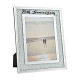 25th Anniversary photo frame with crystal border on silver mirror finish, white inner mat, and black script text, holding a 7 x 5in beach couple photo on a white background.