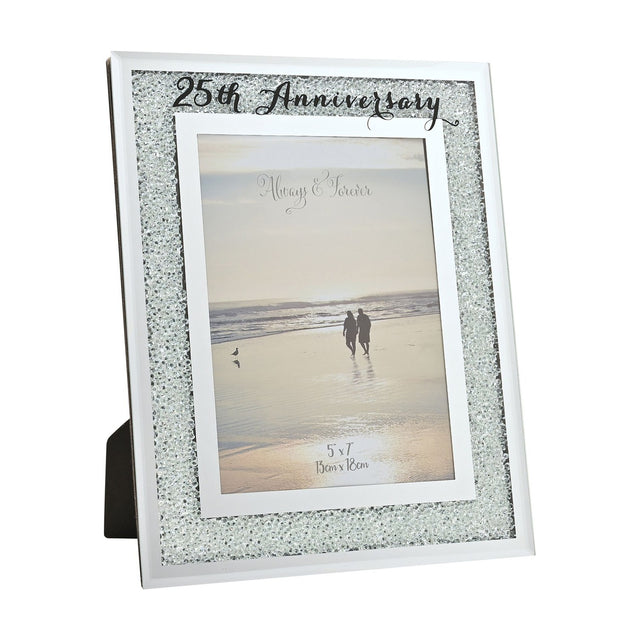 25th Anniversary photo frame with crystal border on silver mirror finish, white inner mat, and black script text, holding a 7 x 5in beach couple photo on a white background.