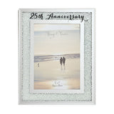 25th Anniversary photo frame with a sparkling crystal border on a silver mirror finish, white inner mat, and "25th Anniversary" script at the top, holding a 7 x 5in photo.