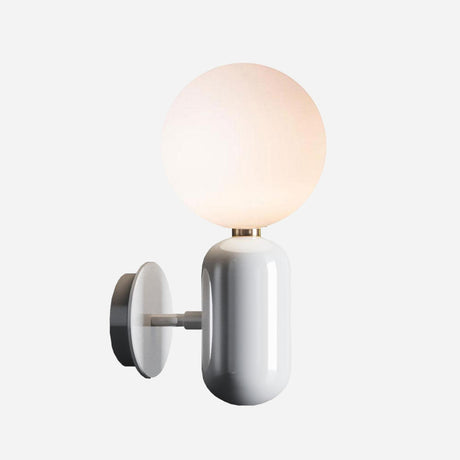 The Pallo Wall Light - White is a contemporary wall sconce featuring a streamlined, white cylindrical base and an opal glass diffuser. It provides a warm glow that elevates its minimalist design, bringing elegant simplicity to any plain background.