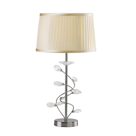 The Willow 1 Light Crystal Table Lamp features a chrome base, clear crystal leaf accents on the stem, and a cream pleated shade for a touch of contemporary elegance.