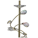 Close-up of the Willow 1 Light Crystal Table Lamp in antique brass with a gold metal stand and teardrop-shaped crystal accents spiraling around it, reflecting subtle rainbow hues. Shown with white shade on a white background.