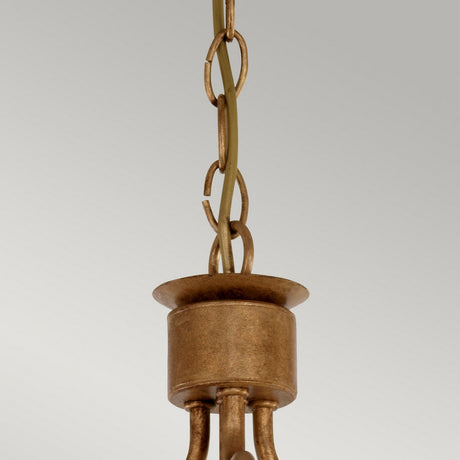 Close-up of a vintage-style Windsor 3 Light Chandelier in gold patina, featuring a decorative chain and cylindrical canopy against a plain background.