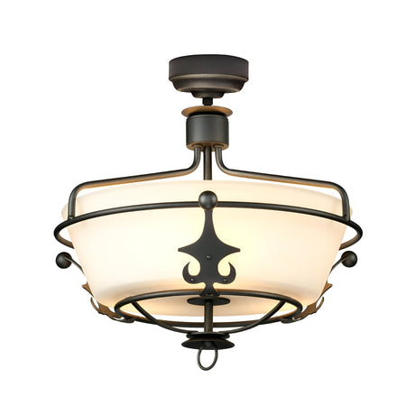 The Windsor 3 Light Semi-Flush - Graphite ceiling fixture features a regal design with a circular frosted glass shade enclosed in a black metal frame. It includes decorative metal accents with a graphite finish and hangs from a short stem attached to the ceiling.