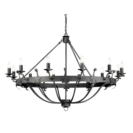 The Windsor 12 Light Chandelier - Graphite features a striking black wrought iron design, providing statement lighting with its two tiers of candle-shaped bulbs arranged in a circular pattern. Suspended by chains, this chandelier exudes a vintage, industrial style.