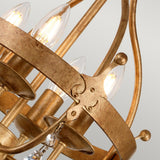 A close-up of the Windsor 4 Light Chandelier - Gold Patina showcases this handcrafted UK masterpiece with its candle-shaped bulbs and delicate crystal accents, embodying an elegant and classic design. The neutral gray background highlights the chandelier's intricate details.