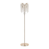 The Wisteria 4 Light Crystal Floor Lamp in French Gold features a sleek metal base and stem, adorned with cascading crystal-like strands for chandelier-inspired elegance and ambient lighting.