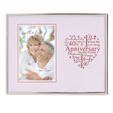 Silver metal rectangular photo frame with a 4x6in opening for a couple's photo, beside a red heart-shaped word design reading "40th Anniversary" on a white mount.