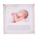 Silver metal photo frame with "baby" script and heart detail, holding a 6 x 4in landscape photo in a white mount above a printed message, set on a plain background.