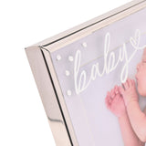 Close-up of the Baby Word Metal Photo Frame's silver corner, showing white script "baby" text with a heart and small crystal accents over a baby photo.