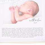 Silver metal photo frame with "baby" in white script, holding a 6 x 4in landscape photo in a white mount above a printed baby-themed verse, "with love" caption shown.