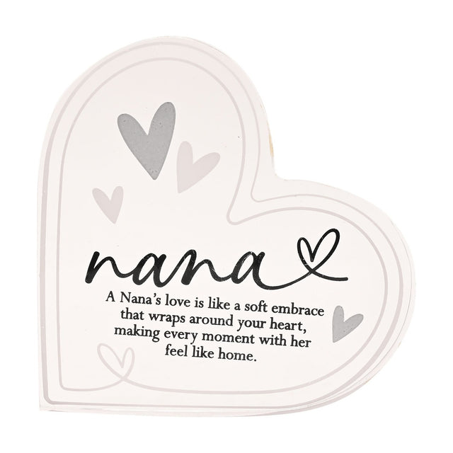 Freestanding clear acrylic heart decoration printed with "nana" in black script, a looped heart accent, grey heart motifs, and a nana's love verse below, on a plain white background.