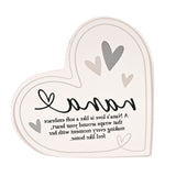 Freestanding clear acrylic heart decoration with "nana" in black script, grey and beige heart motifs, and a printed verse, shown on a plain white background.