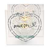 Square glass tealight candle holder with two clear panels, a heart of small white hearts, "mum" in black script, and a surrounding ring of sentimental words, lit candle visible, on a white background.