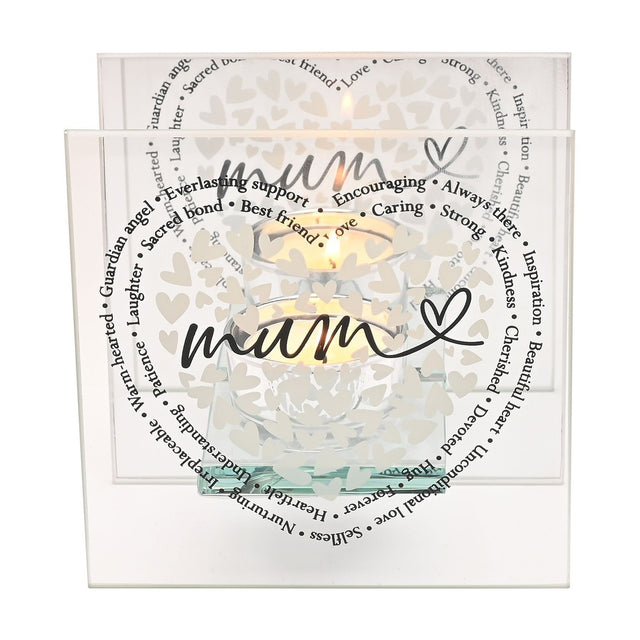 Square glass tealight candle holder with two clear panels, a heart of small white hearts, "mum" in black script, and a surrounding ring of sentimental words, lit candle visible, on a white background.