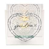 Square glass tealight holder with two lit candles, engraved with grandma in script, surrounded by small hearts and words like guardian angel and best friend.