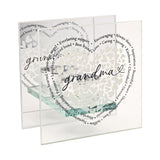 Square glass tealight holder with clear panels featuring Grandma in black script, white heart motifs, and a ring of printed phrases like Everlasting support and Best friend.