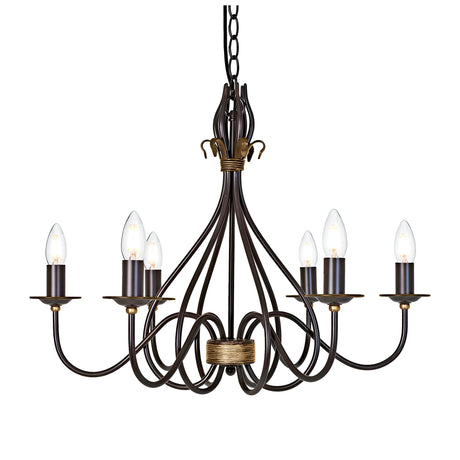 The Windermere 6 Light Chandelier in Rust/Gold is a handcrafted wrought iron fixture featuring a detailed design. It hangs from a chain and includes six candle-shaped light bulbs arranged in a circular pattern, each perched on its own small platform extending from the central structure, offering rustic elegance.