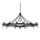 The Warwick 12 Light Chandelier - Graphite Black is a magnificent work of medieval craftsmanship, featuring a striking Graphite Black finish. This grand circular wrought iron piece is suspended by chains and showcases 12 lit candle-style bulbs, ideal for infusing any space with old-world charm.