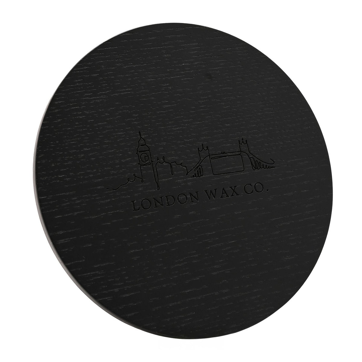 Round black lid of the Enjoy the Silence 3 Wick Scented Candle, showing an engraved London skyline line drawing above "London Wax Co." text, on a white background.