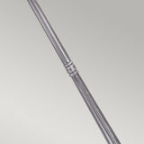 A close-up view of a polished metal rod reminiscent of the sophisticated design of the Wexford 2 Light Lamp Post - Black/Silver, featuring a decorative ring detail in the center, set against a plain light gray background. The rod's shiny surface is highly reflective.