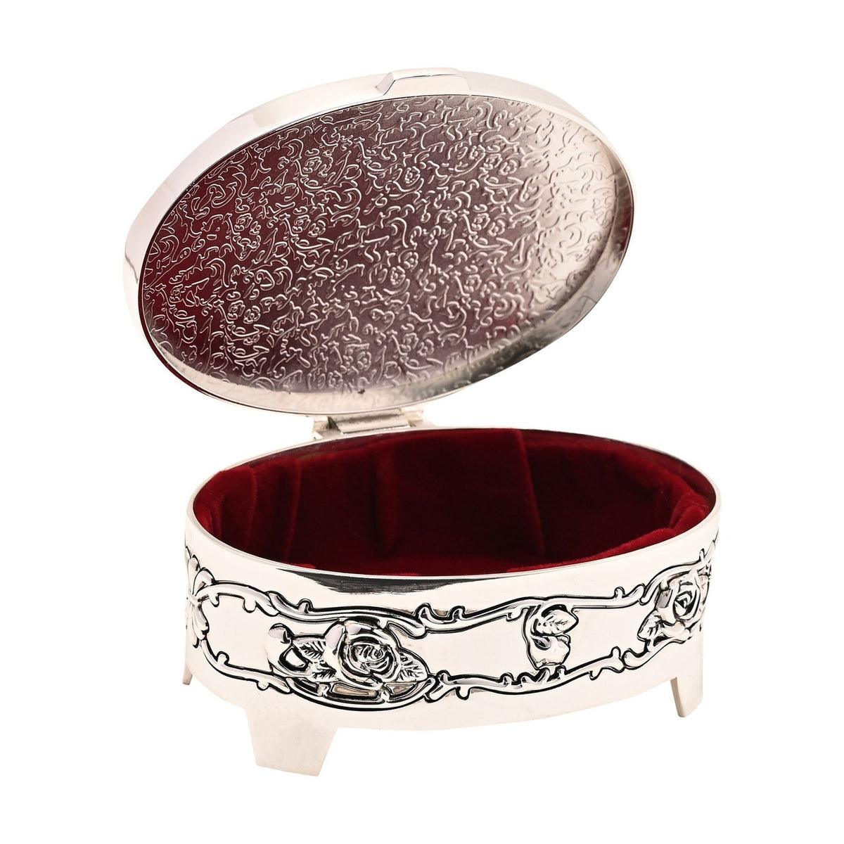 Oval silverplated trinket box with embossed rose and leaf design, standing on four feet, lid open showing dark red velvet lined interior, on white background.