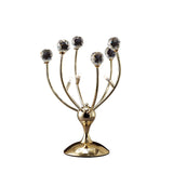 The Xeena 3 Light Crystal Table Lamp features three curved branches topped with faceted crystal-like orbs on a shiny round base, offering a modern look in an elegant French gold finish.
