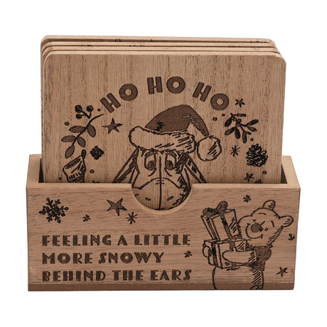 Set of 4 square wooden Christmas coasters in a matching holder, brown wood grain engraved with Eeyore in a Santa hat and a festive "Ho Ho Ho" design, on a white background.