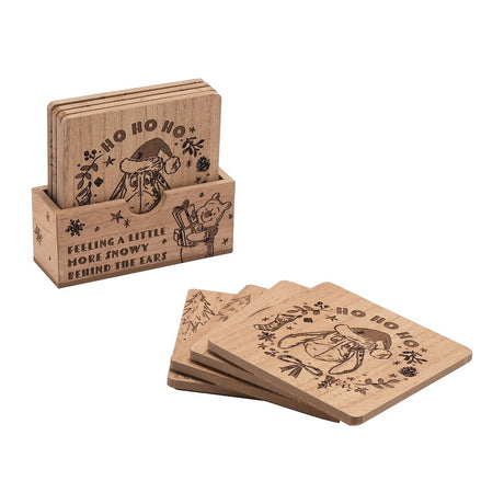 Set of 4 square wooden Christmas coasters with Winnie the Pooh characters engraved in brown line art, one stack in a wooden holder and four fanned out, on a plain white background.