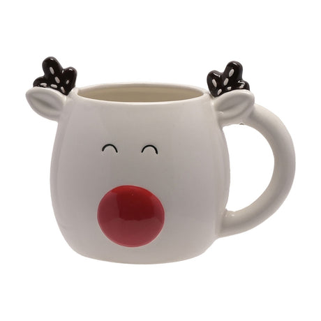 White stoneware reindeer mug with ears, black and white dotted antlers, closed smiling eyes, and a raised red nose, shown on a plain white background.