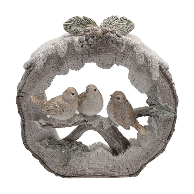Round log resin figurine depicting three robins perched on a snowy branch, white and grey-brown tones with bark-textured edge and pinecone accents, on a plain white background.
