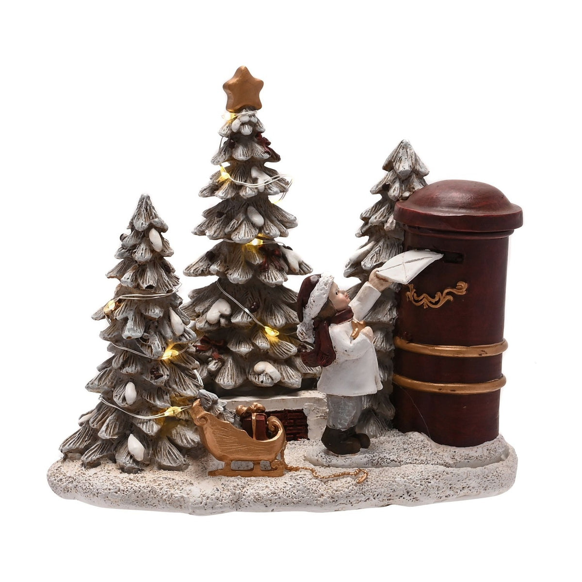 Light-up resin figurine of a boy in a white coat and red scarf mailing a letter in a red pillar box, with frosted fir trees, LED lights, and a gold sleigh on a snowy base.