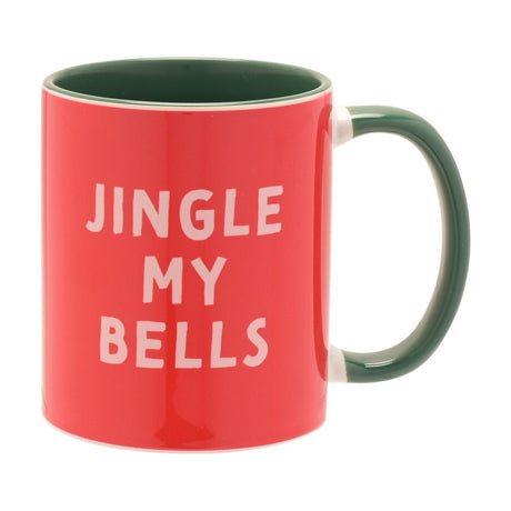 Red stoneware mug with dark green handle and interior, featuring "JINGLE MY BELLS" in bold white capital letters, shown on a plain white background.