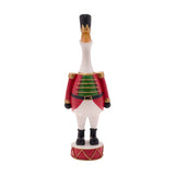 Christmas Soldier Duck Figurine, 30.7cm resin duck in red tunic with gold epaulettes, green chest panel, black hat and boots, standing on a red drum base, plain white background.