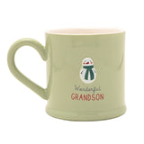 Green stoneware mug with a pink interior, featuring an embossed snowman in a striped scarf and "Wonderful GRANDSON" text, shown on a white background.
