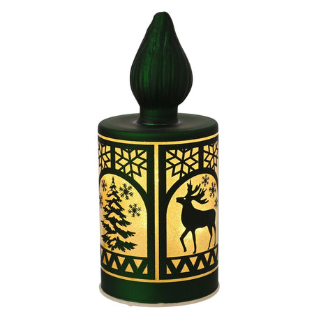 Green glass LED Christmas candle with ribbed flame top, cylindrical body showing arched window designs of a stag and snowy fir tree, on a plain white background.
