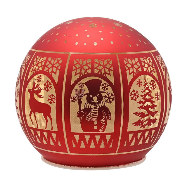 Round red glass light-up Christmas globe decoration with gold arched window panels showing a reindeer, snowman and fir tree, snowflake details, on a plain white background.