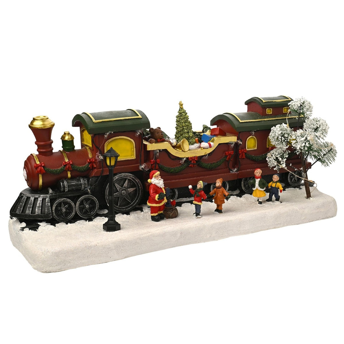 Christmas Train Scene light-up decoration featuring a red steam engine with gold chimney, wagon of presents and tree, Santa and children figures on a snowy white base.
