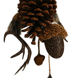 Pinecone and acorn hanging Christmas tree decoration with glittered antlers, a textured acorn cap, small bell, and fluffy fur tufts in brown tones on a white background.