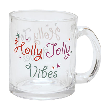 Clear glass mug printed with looping "Holly Jolly Vibes" text in red, purple and green with matching scattered stars, shown against a plain white background.