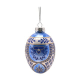 Oval painted glass egg Christmas tree decoration in blue and white, with gold leaf sprigs, a scrolling motif with clear sparkling stud, and a silver hanging loop, shown on a plain white background.