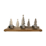 Metal and wood 3 tealight candle holder with five silver Christmas tree silhouettes rising behind three round metal tealight cups on a brown wood base, shown on a white background.