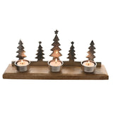 Metal and wood tealight candle holder with five silver Christmas tree silhouettes on a rectangular wooden base, holding three lit tealights in round silver cups, shown on a white background.