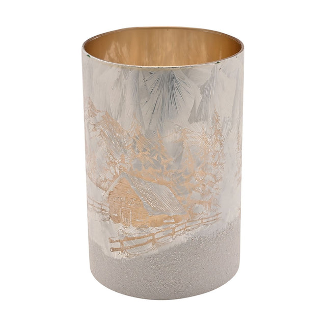 Winter Cabin Frosted Glass Candle Holder 13.5cm in white, a round cylinder with gold cabin and tree scene, frosted icy texture, and a gold-toned interior, shown on a plain white background.